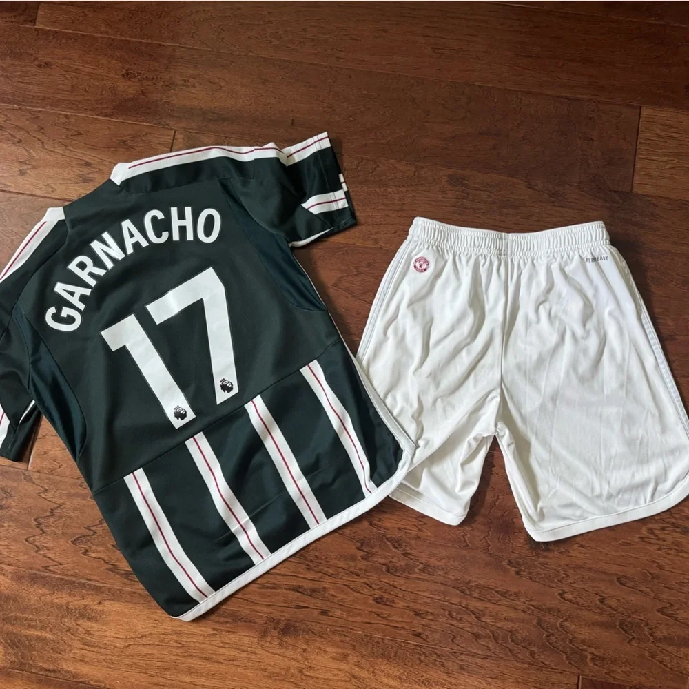 White Adidas Soccer Shorts with Red Manchester United Logo, size Medium 11-12Y